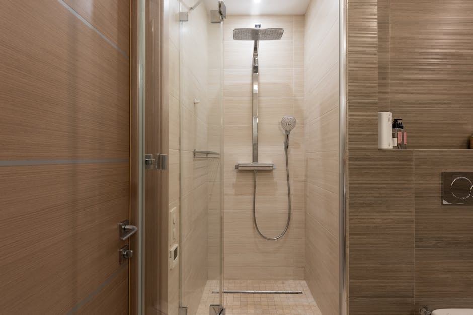 Modern walk-in shower design with clear glass
